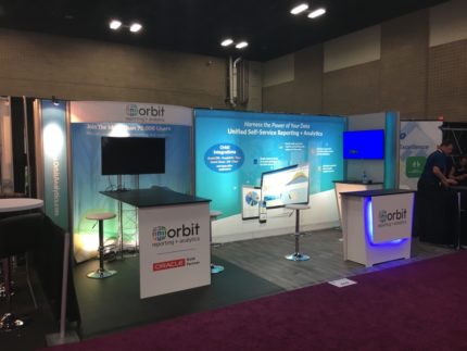 Trade show exhibit with flat screen and bright graphics